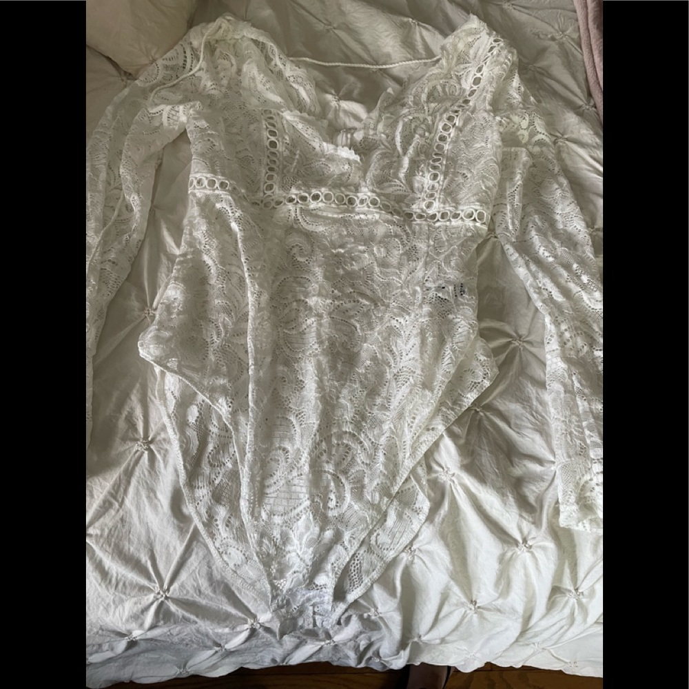 White long sleeve lace bodysuit Looks great with red bra and black leather pants